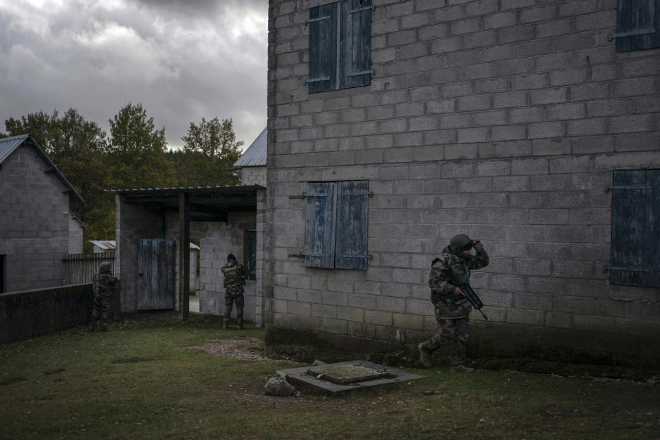 Ukrainian infantrymen train with French soldiers to learn combat skills, in France, Tuesday, Nov. 7, 2023. With the full-scale war grinding into a second winter, and casualties already counted in the hundreds of thousands continuing to mount on both sides, the training has become crucially important for Ukraine's chances of victory. (AP Photo/Laurent Cipriani)