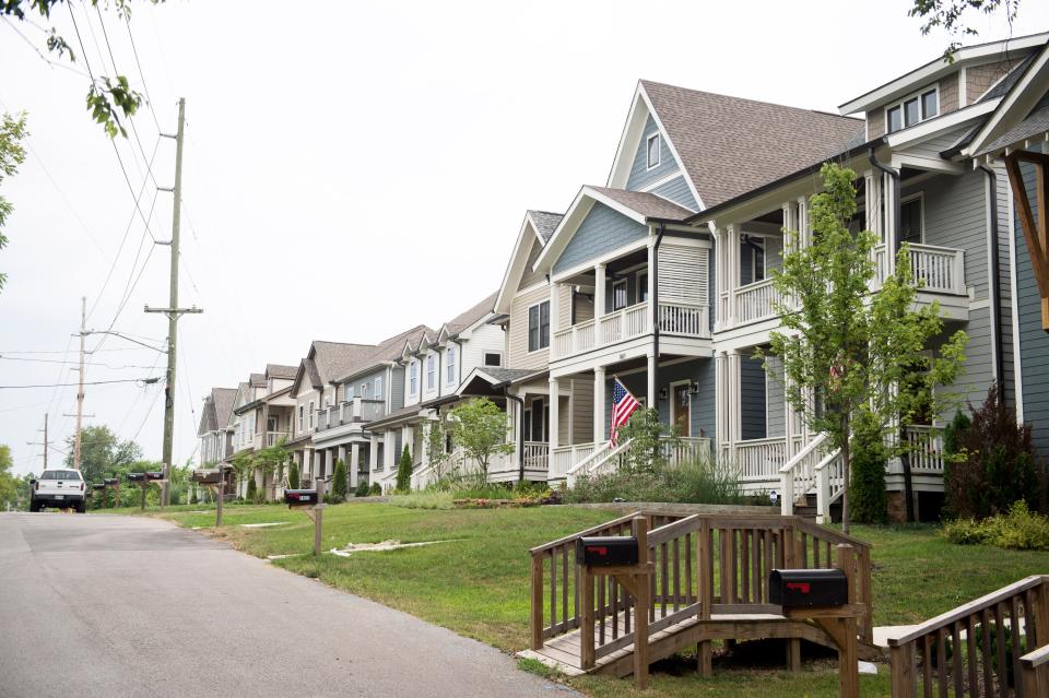 Recently built homes without large older trees on McEwen Avenue in Nashville, Tenn.