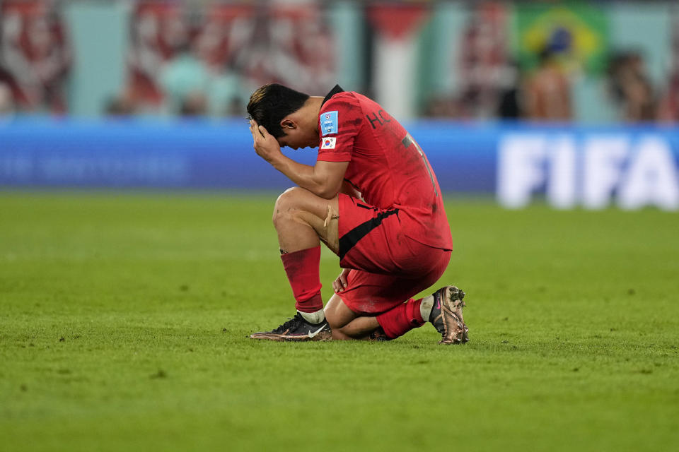 South Korea's Hwang Hee-chan react at the end of the World Cup round of 16 soccer match between Brazil and South Korea, at the Stadium 974 in Doha, Qatar, Monday, Dec. 5, 2022. Brazil won 4-1. (AP Photo/Martin Meissner)