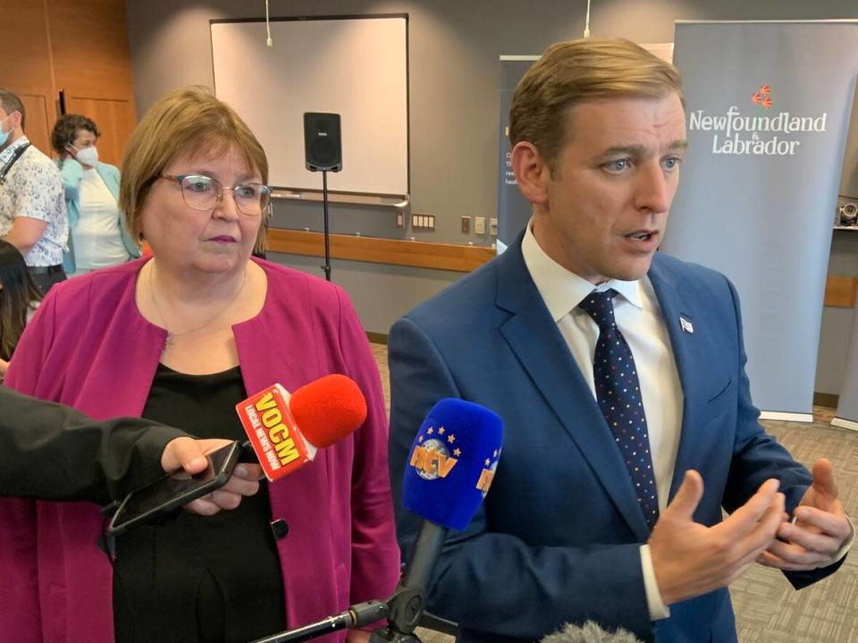 Memorial University's dean of medicine, Dr. Margaret Steele, left, and Newfoundland and Labrador Premier Andrew Furey on Tuesday announced five more seats in MUN's undergraduate MD program for Newfoundland and Labrador residents. (Darrell Roberts/CBC - image credit)