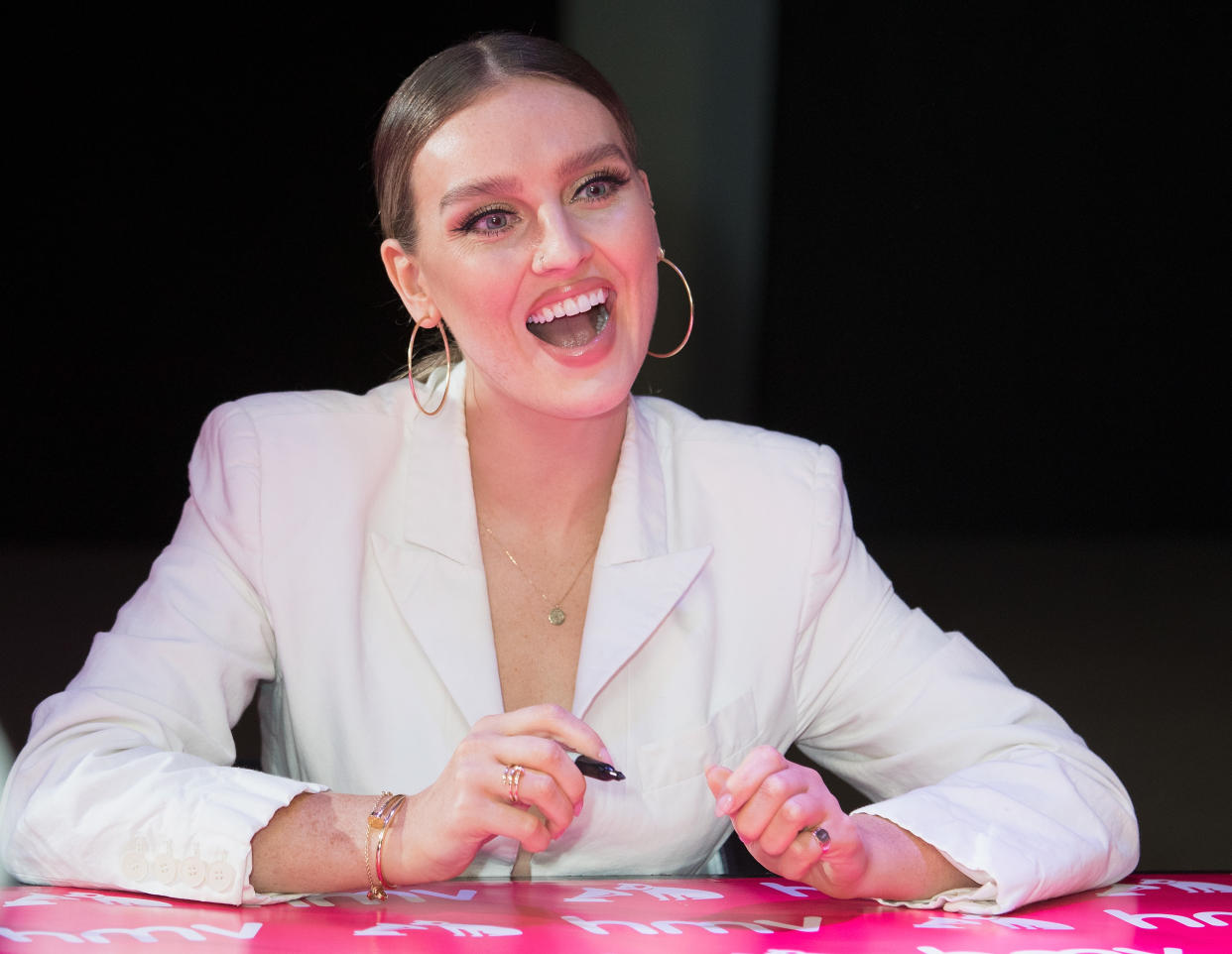 LONDON, ENGLAND – NOVEMBER 19: Perrie Edwards of Little Mix signs copies of their new Album LM5 at HMV Oxford Street on November 20, 2018 in London, England. (Photo by Jo Hale/Redferns)