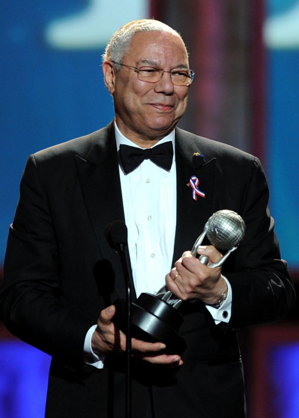 Colin Powell accepts the President’s award onstage at the 42nd NAACP Image Award in 2011 (Getty Images)