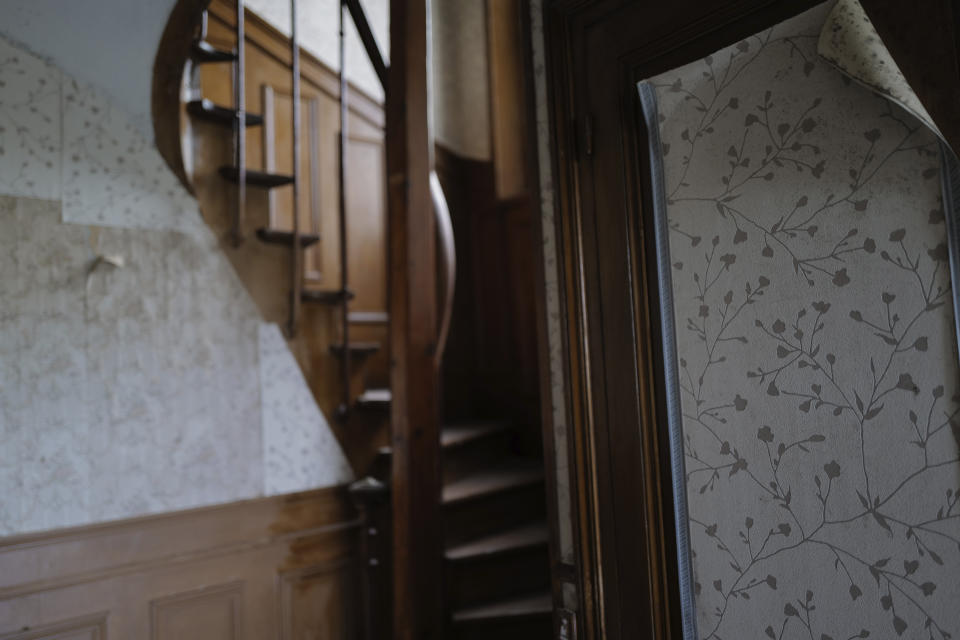 The interior wooden staircase of the 120 sq. meters (1,300 sq. feet) stone house where the Nobel-winning scientist couple Marie Sklodowska-Curie and Pierre Curie spent vacation and weekends from 1904-1906 in Saint-Remy-les-Chevreuse, on the south-west outskirts of Paris, France, Wednesday, May 12, 2021. Poland's prime minister Mateusz Morawiecki says he's given instructions for the government to buy 790,000 euro house in France, and said on Twitter Tuesday that the house, is a "part of Poland's history." (AP Photo/Francois Mori)