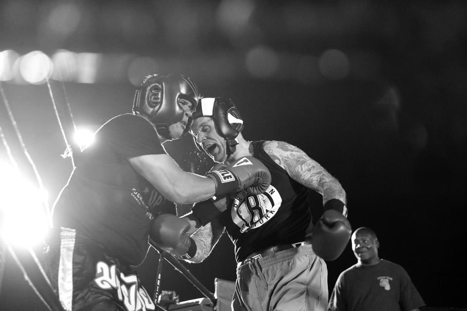 <p>Sgt. John Keigans and Sgt. Billy Polanco mix it up during a grudge match at the Brooklyn Smoker in the parking lot of Gargiulo’s Italian restaurant in Coney Island, Brooklyn, on Aug. 24, 2017. (Photo: Gordon Donovan/Yahoo News) </p>