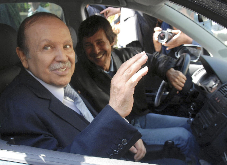 FILE - This Friday April 10, 2009 file photo shows Algerian President Abdelaziz Bouteflika, left, and his brother Said Bouteflika arrives at his campaign headquarters in the Hydra district of Algiers, a day after the Algerian presidential election. The influential younger brother of Algeria's former longtime president was detained Saturday May 4, 2019, for questioning along with two generals who previously ran state security agencies, a security official said. (AP Photo, File)