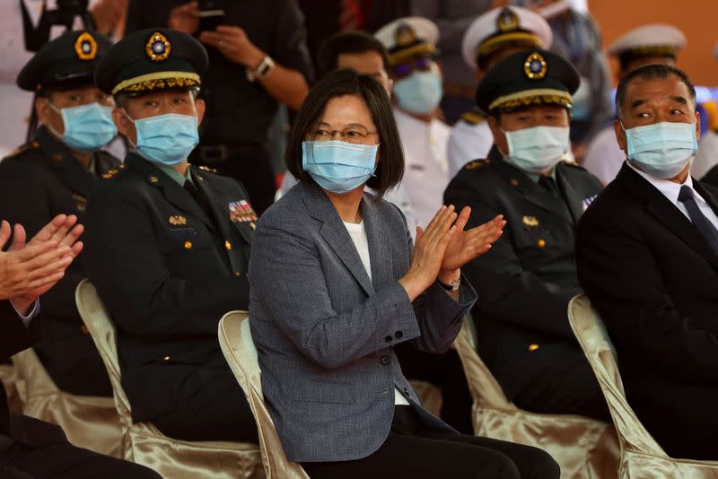 Taiwan's President Tsai Ing-wen applauds during the launch ceremony for Taiwan Navy's domestically built amphibious transport dock "Yushan" in Kaohsiung