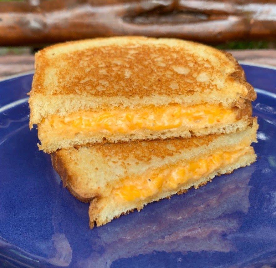 <p><strong>Pimento Cheese Sandwich</strong><br><br>A local staple to southern states is pimento cheese -- a spread or relish combining shredded cheese, pimentos and mayonnaise. Georgia offers many variations on this lunchbox classic, many of which you can find on <a href="https://buttermilkkitchen.com/" rel="nofollow noopener" target="_blank" data-ylk="slk:Buttermilk Kitchen;elm:context_link;itc:0;sec:content-canvas" class="link ">Buttermilk Kitchen</a>’s menu. This sandwich comes with housemade pickles, red pepper jelly and white toast.</p>