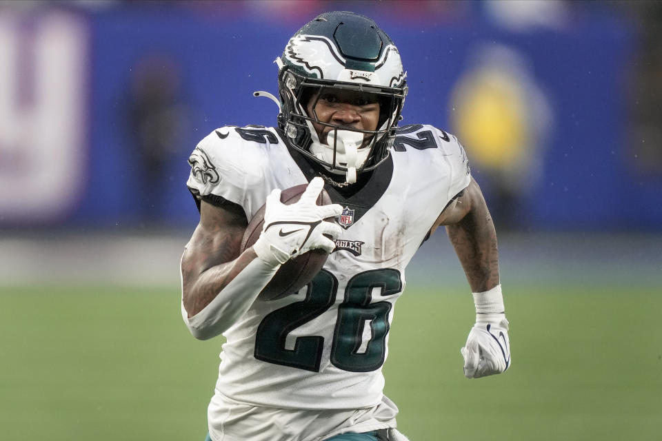 Philadelphia Eagles running back Miles Sanders (26) runs for a touchdown against the New York Giants during the fourth quarter of an NFL football game, Sunday, Dec. 11, 2022, in East Rutherford, N.J. (AP Photo/John Minchillo)