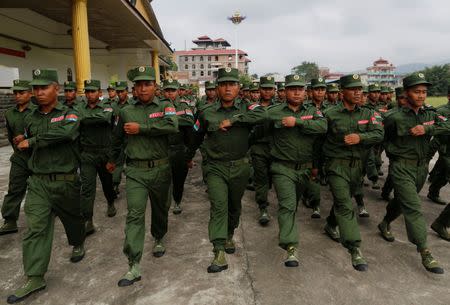 United Wa State Army (UWSA) soldiers march during a media display in Pansang, Wa territory in northeast Myanmar October 4, 2016. Picture taken on October 4, 2016. REUTERS/Soe Zeya Tun