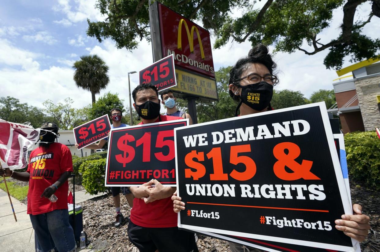 <span class="caption">The fight over the minimum wage continues.</span> <span class="attribution"><a class="link " href="https://newsroom.ap.org/detail/MinimumWageProtest/590686ec283c4099b9bbe98af4d14942/photo?Query=minimum%20wage%20protest&mediaType=photo&sortBy=arrivaldatetime:desc&dateRange=Anytime&totalCount=533&currentItemNo=0" rel="nofollow noopener" target="_blank" data-ylk="slk:AP Photo/John Raoux;elm:context_link;itc:0;sec:content-canvas">AP Photo/John Raoux</a></span>