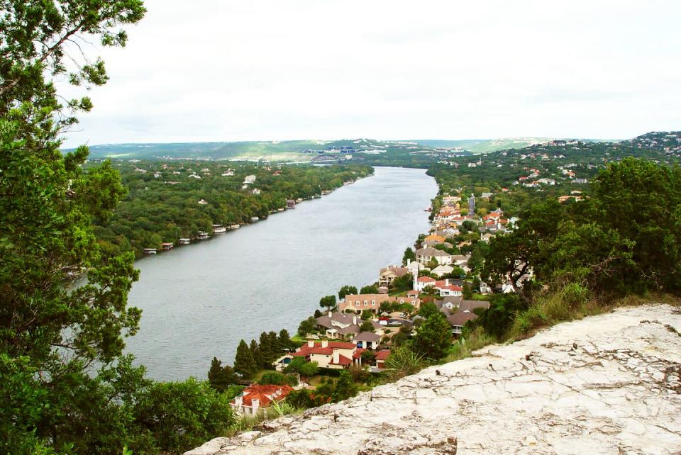 <p>Nestled in a bougie residential neighborhood a few minutes from downtown, <a href="https://mountbonnell.com/" rel="nofollow noopener" target="_blank" data-ylk="slk:this trek" class="link ">this trek</a> is an iconic Austin tradition that’s all about the views. It’s a pretty short ascent to the top—the stair-like trail takes just about 11 minutes—and once you get up there, you’ll see gorgeous Lake Austin and the city skyline down below. Other possible spottings: marriage proposals (it’s def one of those spots), and epic rainbow-sherbet sunsets. </p><p><strong>Miles: </strong>.5 </p><p><strong>Level: </strong>All levels</p><p><strong>More deets: </strong>Plan to climb 100 stairs to 775 feet. Admission is free.</p>
