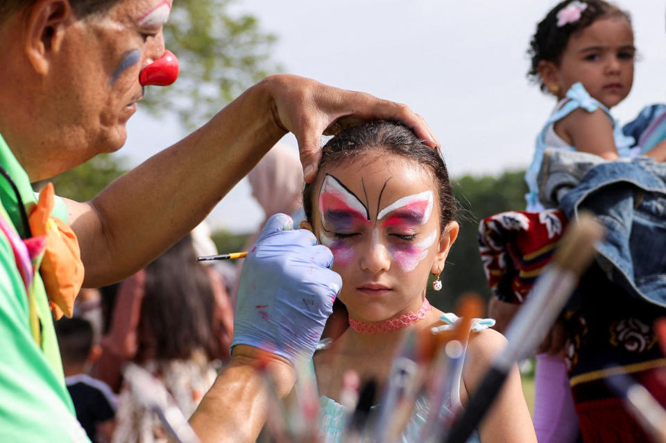 A girl has her face painted during a festival for the Muslim holiday Eid al-Adha in New York. (Amr Alfiky / Reuters file)