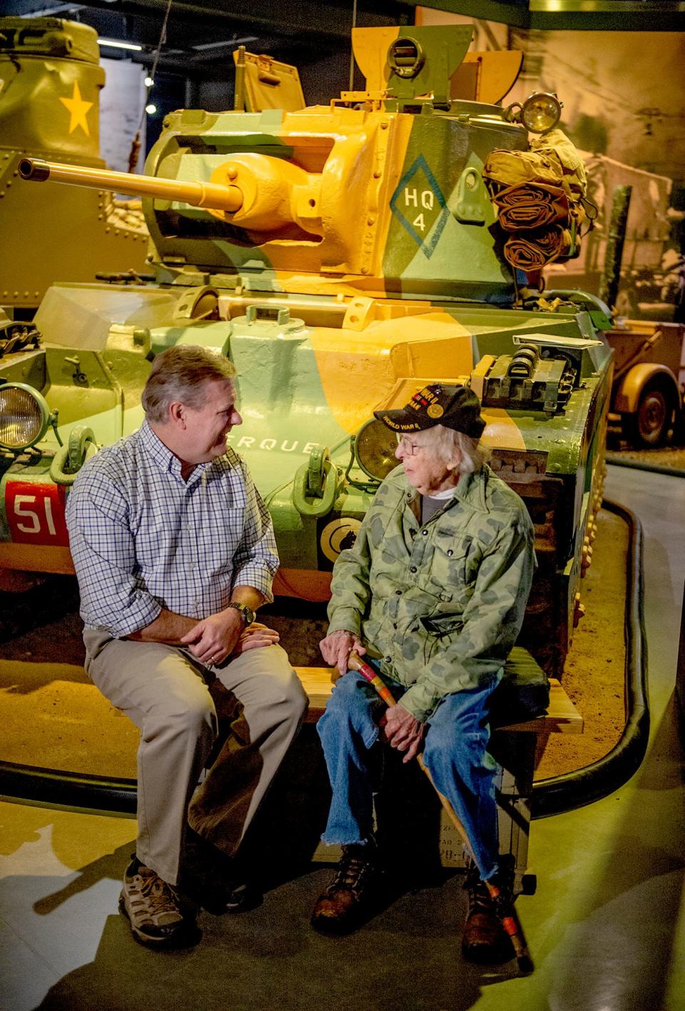 World War II veteran Russell Phipps, 101, of Hopkinton, chats with Hunter Chaney, director of marketing and communications at the American Heritage Museum in Hudson, Dec. 29, 2022.