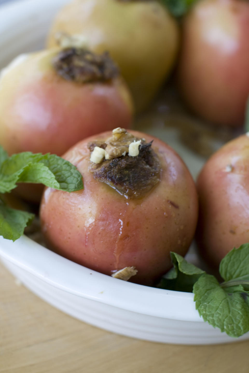 This July 29, 2013 photo shows baked honey date apples in Concord, N.H. (AP Photo/Matthew Mead)