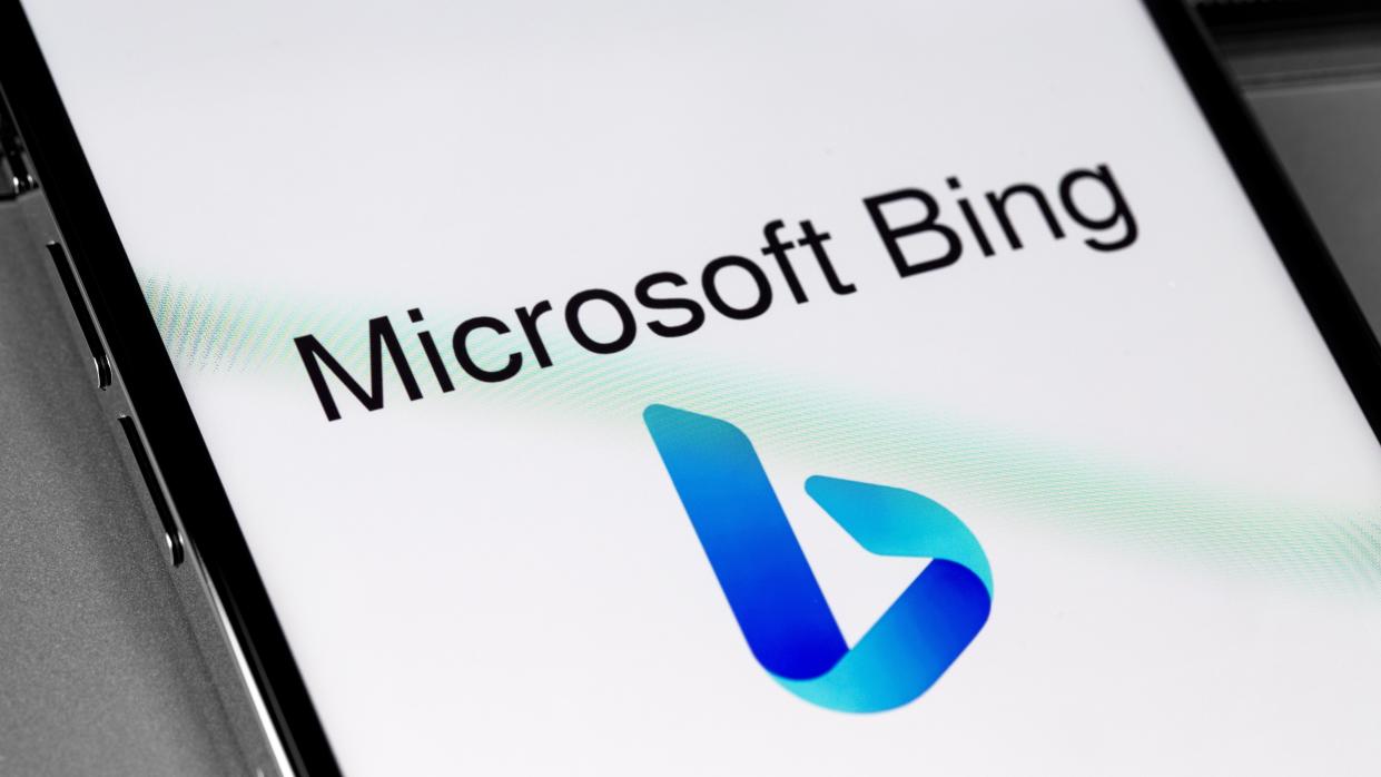  Microsoft Bing logo on a white smartphone screen 