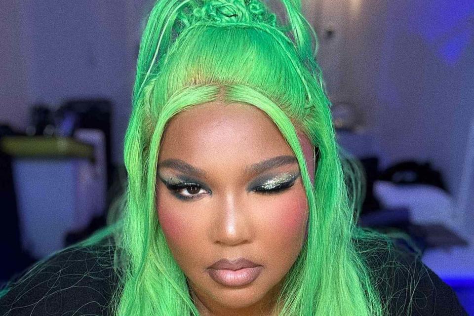 <p>Lizzo Instagram</p> Lizzo shows off her new neon-green hairstyle