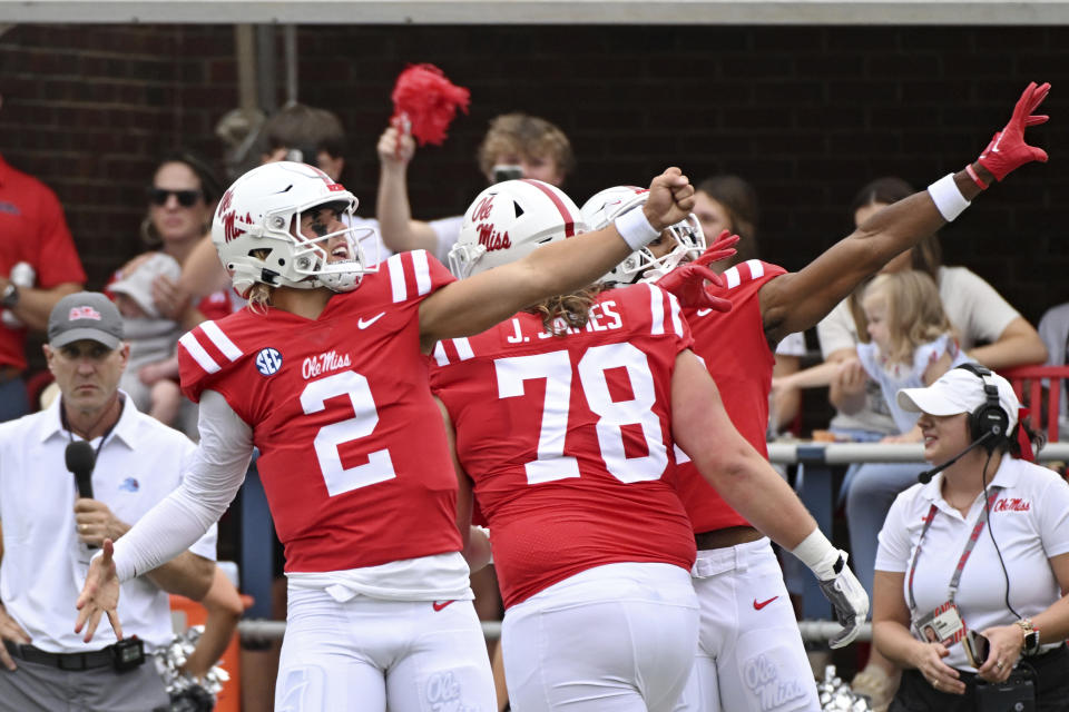 Mississippi quarterback Jaxson Dart (2) reacts after a Mississippi touchdown during the first half of an NCAA college football game against Mercer in Oxford, Miss., Saturday, Sept. 2, 2023. (AP Photo/Thomas Graning)