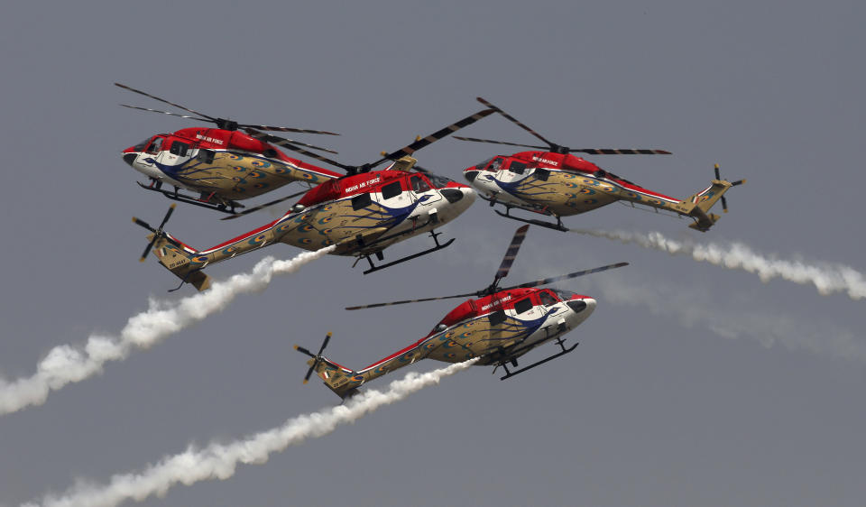 Indian Air Force Saranng helicopters display their skills during Air Force Day parade at Hindon Air Force Station on the outskirts of New Delhi, India, Thursday, Oct. 8, 2020. (AP Photo/Manish Swarup)
