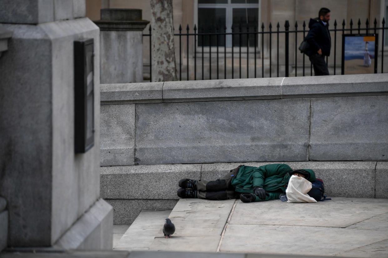 A homeless sleep on the steps of Trafalgar Square, on March 17, 2020 in London, England. Boris Johnson held the first of his public daily briefings on the Coronavirus outbreak yesterday and told the public to avoid theatres and pubs and to work from home where possible. The number of people infected with COVID-19 in the UK has passed 1500 with 55 deaths.  (Photo by Alberto Pezzali/NurPhoto via Getty Images)