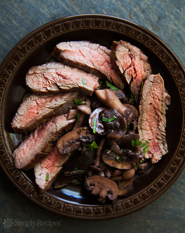 <strong>Get the <a href="http://www.simplyrecipes.com/recipes/grilled_flank_steak_with_mushrooms/" target="_blank">Grilled Flank Steak with Mushrooms recipe</a>&nbsp;from Simply Recipes</strong>