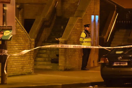 Police officers attend to the scene of a shooting at Poplar Row in Dublin, Ireland February 8, 2016. REUTERS/Clodagh Kilcoyne