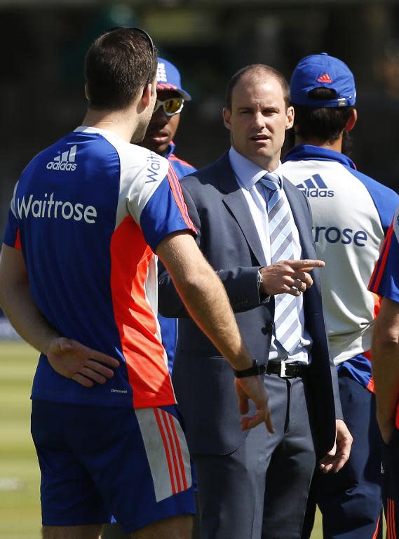 England's director of cricket, Andrew Strauss (R), talks to players and staff at Lord's cricket ground in London, in May 2015
