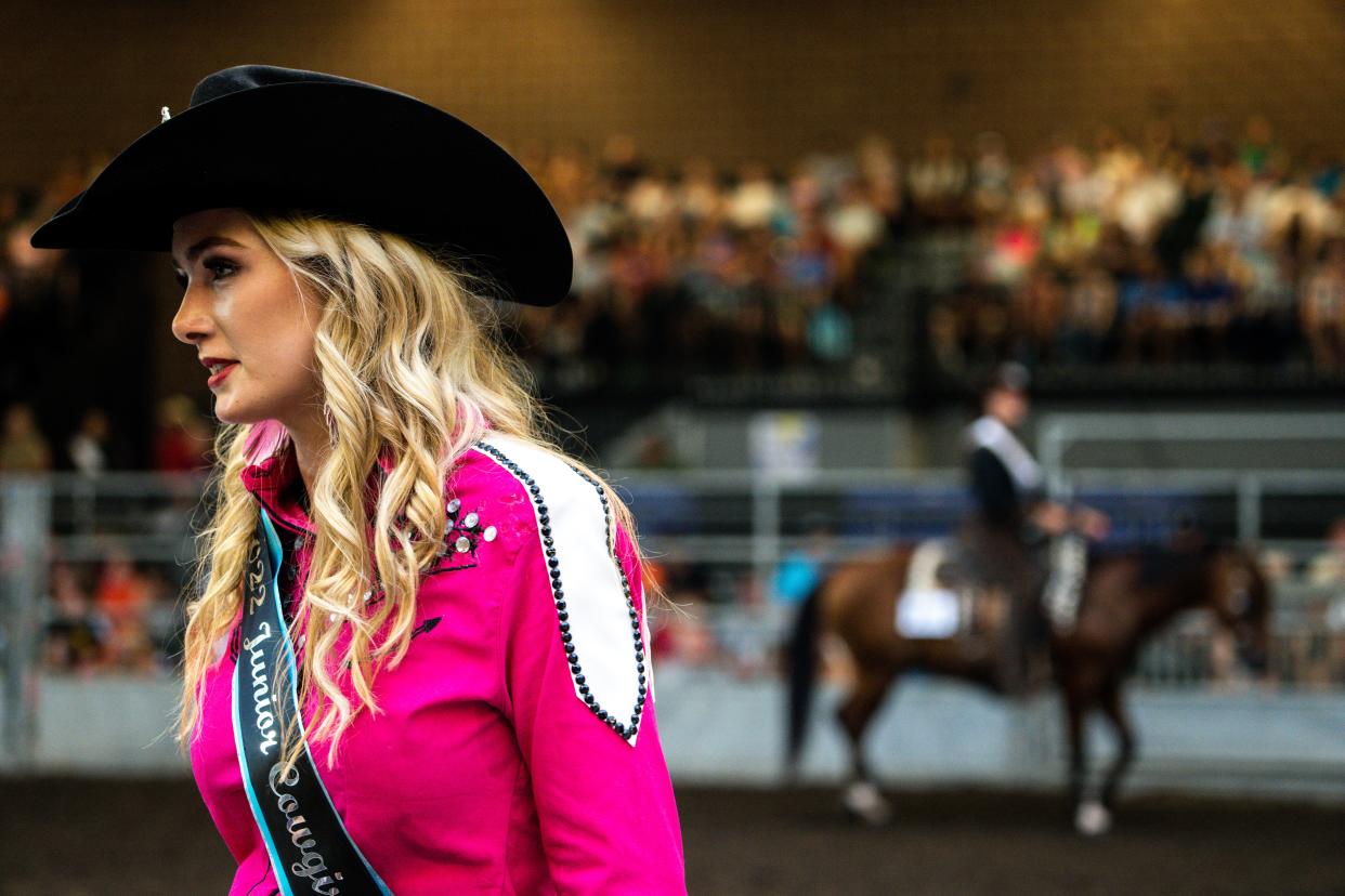 Elivia  watches contestants during the 2023 Junior Cowgirl Queen Contest.