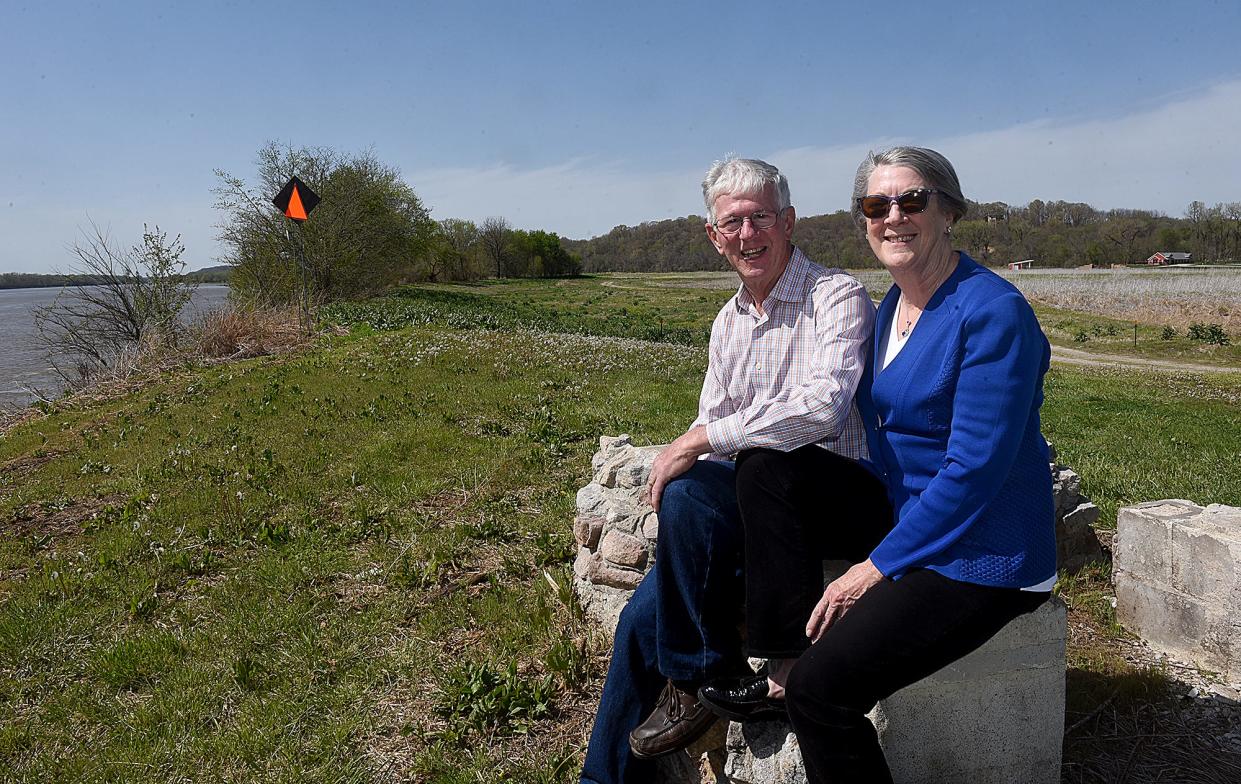 Larry and Brenda Potterfield pose for a photo near the boat ramp at The Station House at Katfish Katy's at 8825 W. Sarr St. in Huntsdale on Wednesday. The Potterfields have donated more than 160 acres, including The Station House, along the Missouri River to The Nature Conservancy for a research, conservation and recreation area that will be open to the public and operated in partnership with Missouri River Relief.