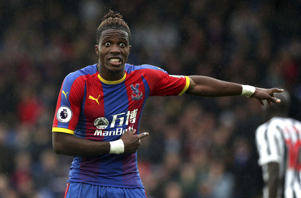 Crystal Palace's Wilfried Zaha appeals the referee's decision, during the English Premier League soccer match between Crystal Palace and Newcastle United, at Selhurst Park, in London, Saturday, Sept. 22, 2018.(Jonathan Brady/PA via AP)