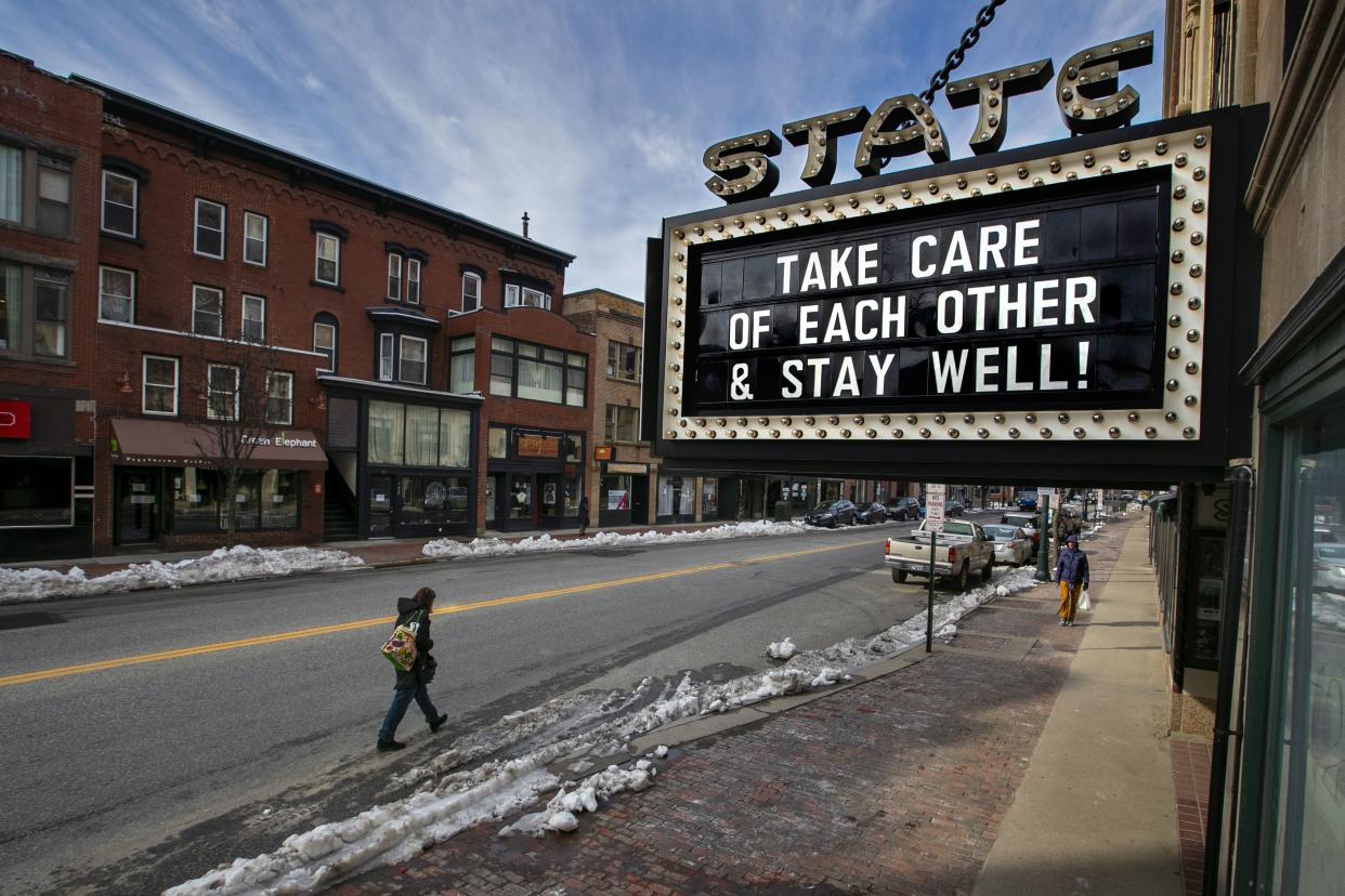 Pedestrians keep their distance in downtown Portland, Maine, just hours before a stay-at-home order goes into effect Wednesday, March 25, 2020, that will close all but essential workplaces in the city. City officials say residents must shelter in place starting at 5 p.m. Wednesday to help slow the spread of the coronavirus. Maine has reached 118 coronavirus cases, the majority in Cumberland and York counties.