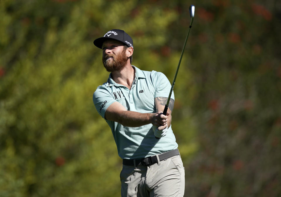 Tyler McCumber watches his tee shot on the fourth hole during the second round of the Genesis Invitational golf tournament at Riviera Country Club, Friday, Feb. 19, 2021, in the Pacific Palisades area of Los Angeles. (AP Photo/Ryan Kang)