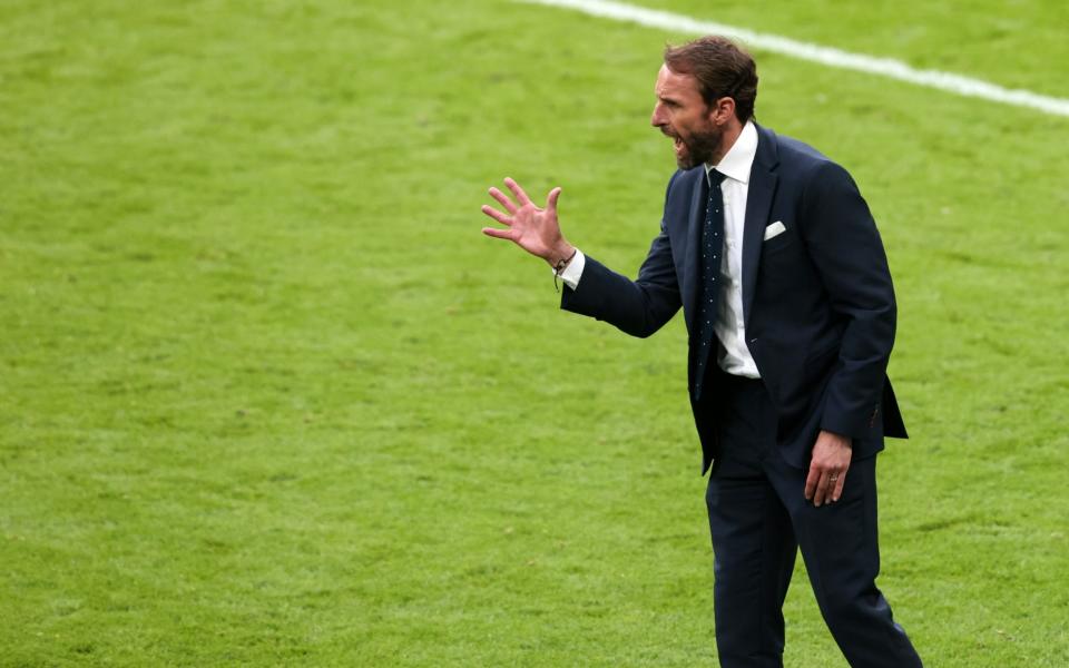 Gareth Southgate relays instructions to his players from the sidelines - GETTY IMAGES