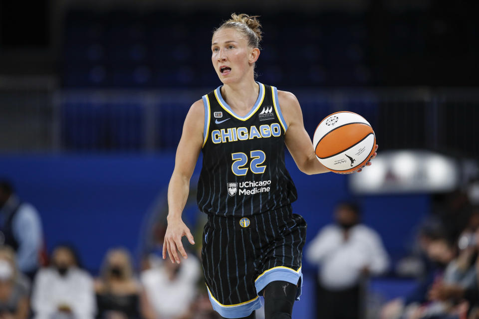 Chicago Sky guard Courtney Vandersloot (22) brings the ball up court against the Dallas Wings during the first half in the first round of the WNBA basketball playoffs, Thursday, Sept. 23, 2021, in Chicago. (AP Photo/Kamil Krzaczynski)