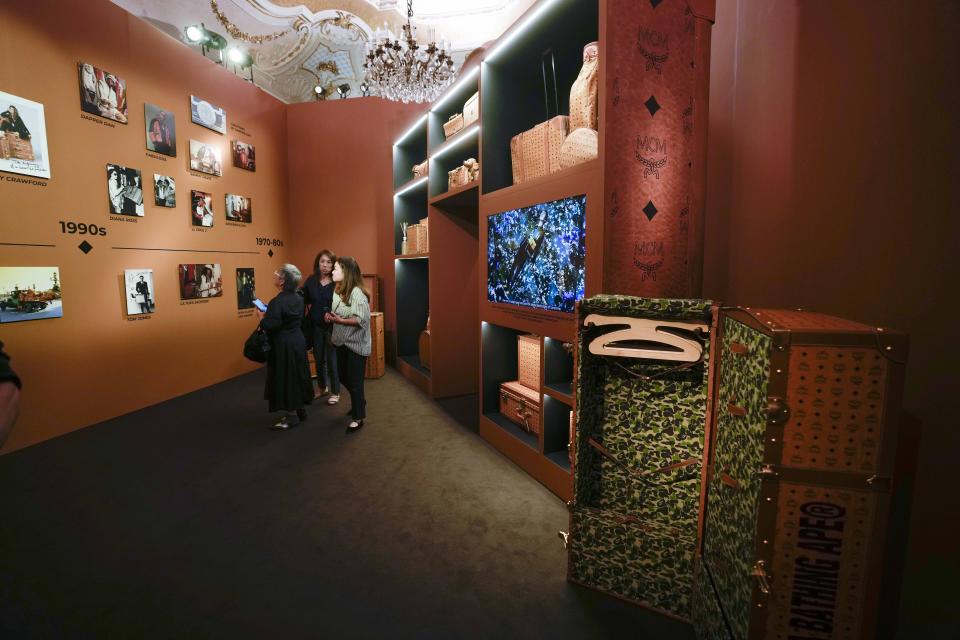 Travel bags and accessories are displayed at the MCM showroom part of the Spring Summer 2024 collection presented in Milan, Italy, Sunday, June 18, 2023. (AP Photo/Luca Bruno)