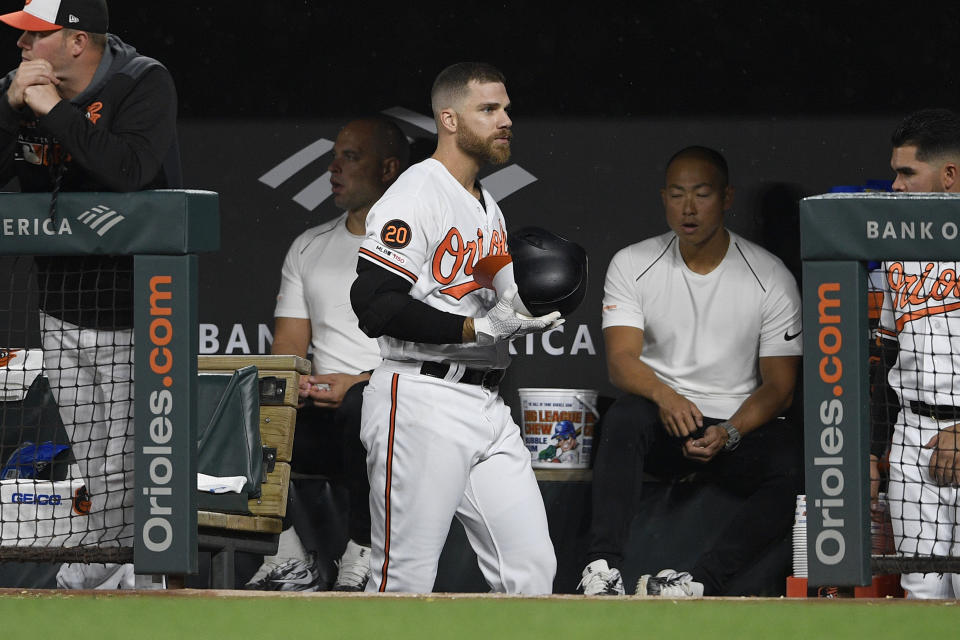 CORRECTS TO SECOND INNING NOT FIRST INNING - Baltimore Orioles' Chris Davis walks in the dugout after he lined out during the second inning of a baseball game against the Oakland Athletics, Monday, April 8, 2019, in Baltimore. (AP Photo/Nick Wass)