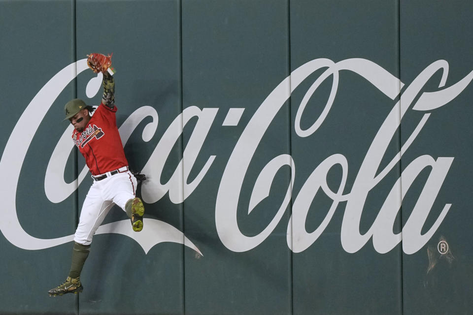 Atlanta Braves right fielder Ronald Acuna Jr. catches a fly ball hit by Seattle Mariners' Cal Raleigh during the seventh inning of a baseball game Friday, May 19, 2023, in Atlanta. (AP Photo/Brynn Anderson)