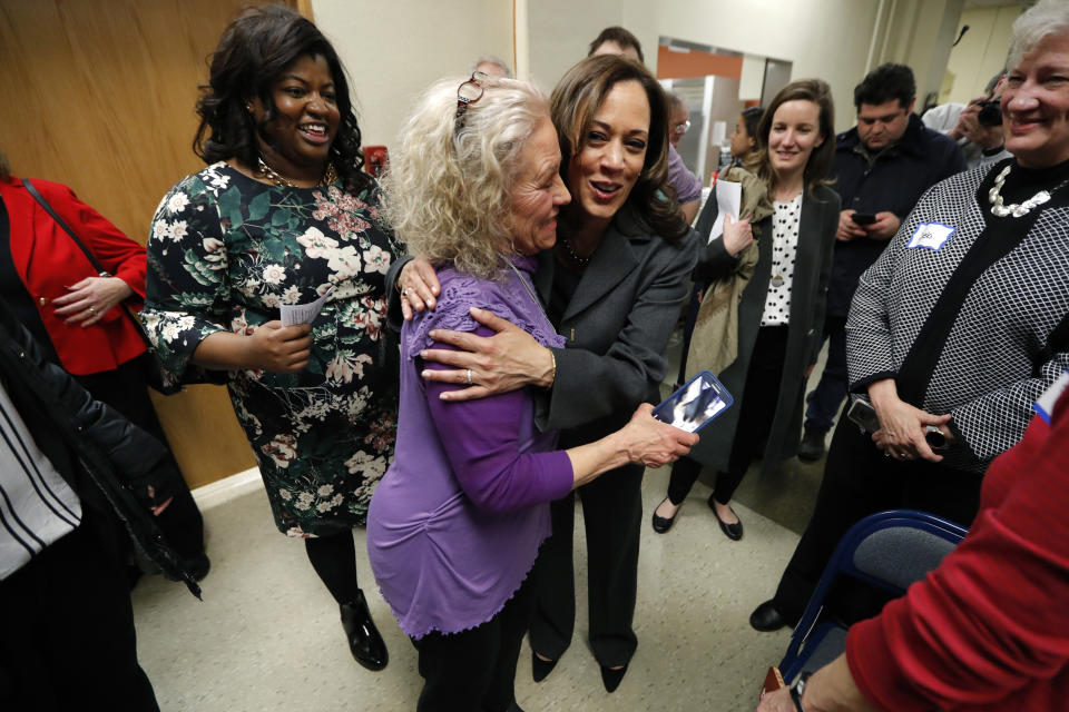 Democratic presidential candidate Sen. Kamala Harris gets a hug from Kathie Whattoff, left, at the Story County Democrats' annual soup supper fundraiser, Saturday, Feb. 23, 2019, in Ames, Iowa. (AP Photo/Charlie Neibergall)
