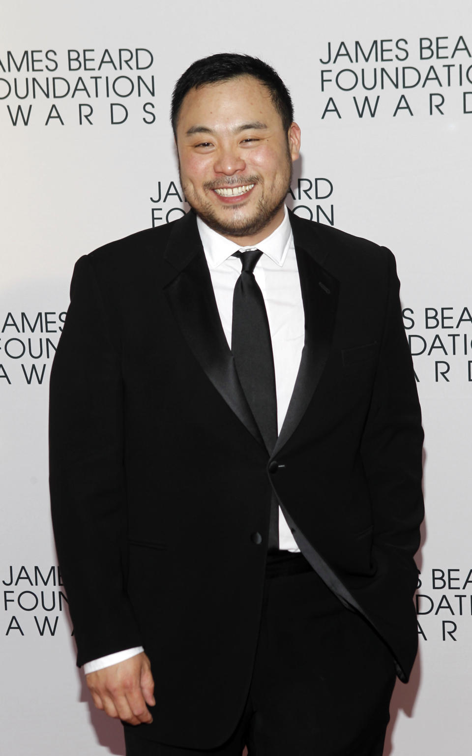 Chef David Chang arrives for the James Beard Foundation Awards, Monday, May 7, 2012, in New York. (AP Photo/Jason DeCrow)