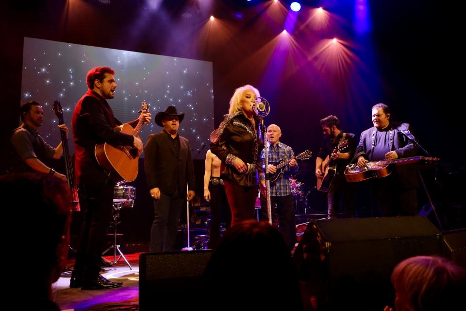 Tanya Tucker seconded by band, onstage at Ryman Auditorium, 6/4/23