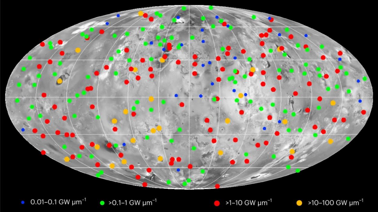  A map of a grey moon dotted with red dots indicating volcanoes. 