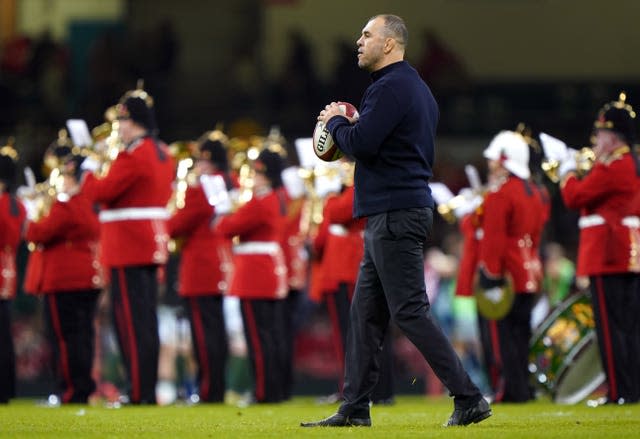 Michael Cheika walks on the pitch