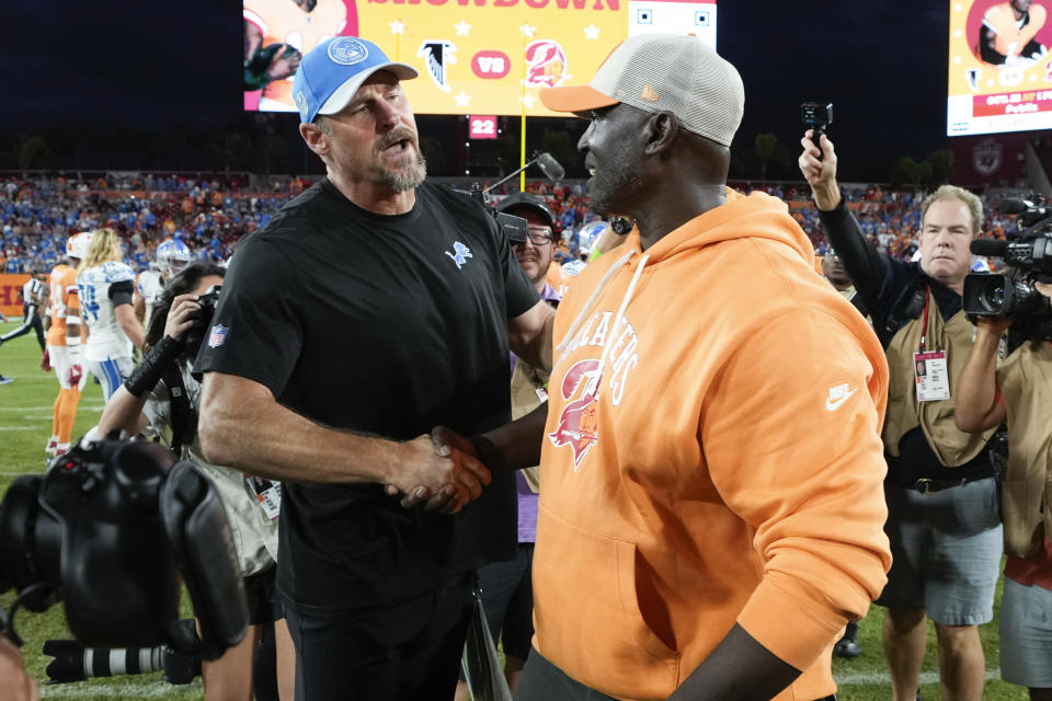 Detroit Lions head coach Dan Campbell, left, and Tampa Bay Buccaneers head coach Todd Bowles talk after an NFL football game Sunday, Oct. 15, 2023, in Tampa, Fla. (AP Photo/Chris O'Meara)