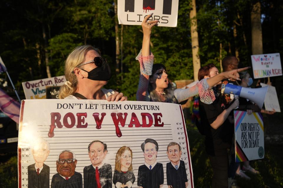 Abortion-rights protesters demonstrate near the home of Associate Justice Clarence Thomas in Fairfax Station, Va. on June 24, 2022 after the Supreme Court opinion in Dobbs v. Jackson Women's Health Organization overturned the landmark 1973 Roe v. Wade decision that established a constitutional right to abortions.