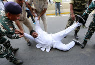 Police detain a supporter of India's main opposition Congress party during a protest demanding the resignation of India's Minister of State for External Affairs Mobashar Jawed Akbar in New Delhi, India, October 15, 2018. REUTERS/Adnan Abidi