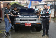 Members of the RNA-16 volunteer group, from left, Arun Saiju, Rajesh Gaiju, Punam Karmacharya and Nhuja Kaiju stand for a photograph during an interview with the Associated Press at a hospital in Bhaktapur, Nepal, Tuesday, May 26, 2020. RNA-16 stands for “Rescue and Awareness” and the 16 kinds of disasters they have prepared to deal with, from Nepal’s devastating 2015 earthquake to road accidents. But the unique services of this group of three men and a woman in signature blue vests in the epidemic amount to a much greater sacrifice, said doctors, hospital officials and civic leaders. (AP Photo/Niranjan Shrestha)