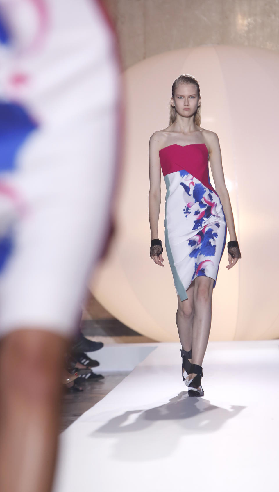 A model wears a creation for French fashion designer Roland Mouret's ready-to-wear Spring/Summer 2014 fashion collection, presented in Paris, Friday, Sept.27, 2013. (AP Photo/Thibault Camus)