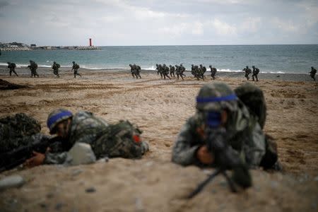 FILE PHOTO: South Korean marines take part in a U.S.-South Korea joint landing operation drill as a part of the two countries' annual military training called Foal Eagle, in Pohang, South Korea, April 2, 2017. REUTERS/Kim Hong-Ji