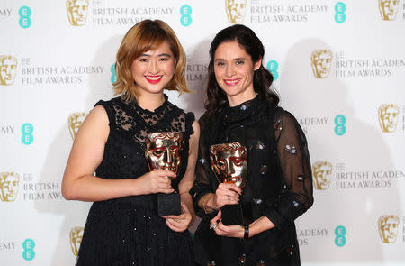 Paloma Baeza and Ser En Low hold their award for British Short Animation for Poles Apart at the British Academy of Film and Television Awards (BAFTA) at the Royal Albert Hall in London, Britain, February 18, 2018. REUTERS/Hannah McKay