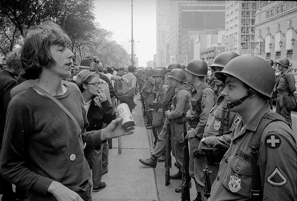 PHOTO: In this Aug. 26, 1968 file photo, a demonstrator stands in front of a row of National Guard soldiers, across the street from the Hilton Hotel in Grant Park, site of the Democratic National Convention in Chicago. (Library Of Congress/Warren K. Leffler via Reuters)