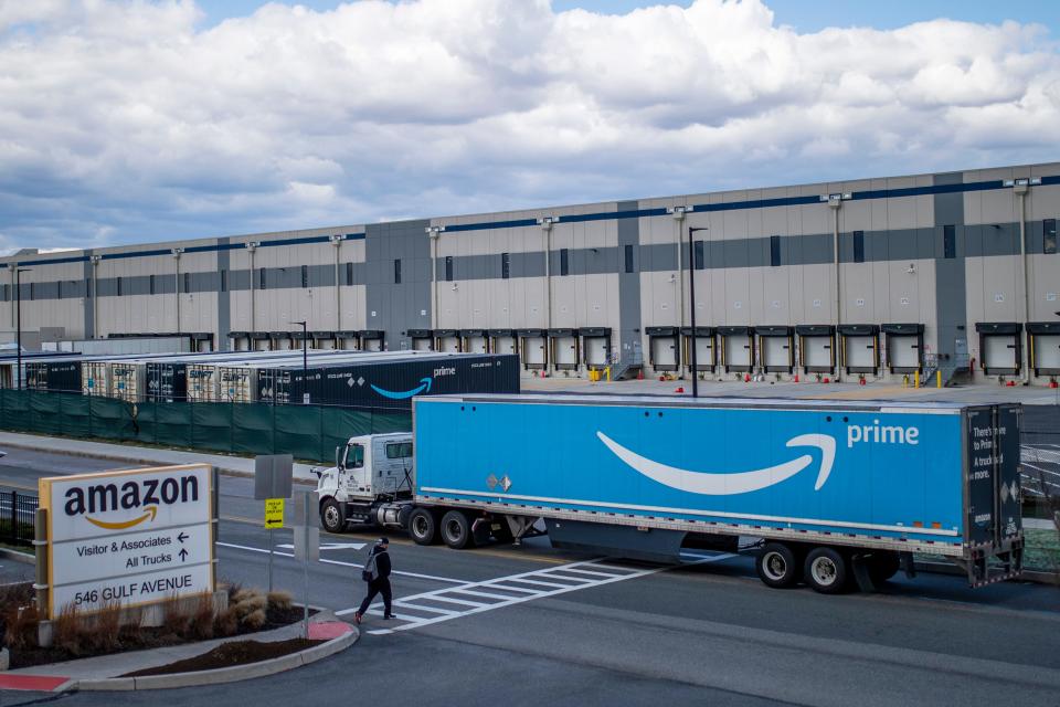 A truck arrives at an Amazon warehouse facility in the Staten Island borough of New York. Amazon is planning to sublease some of its warehouse space because the pandemic-fueled surge in online shopping has slowed.